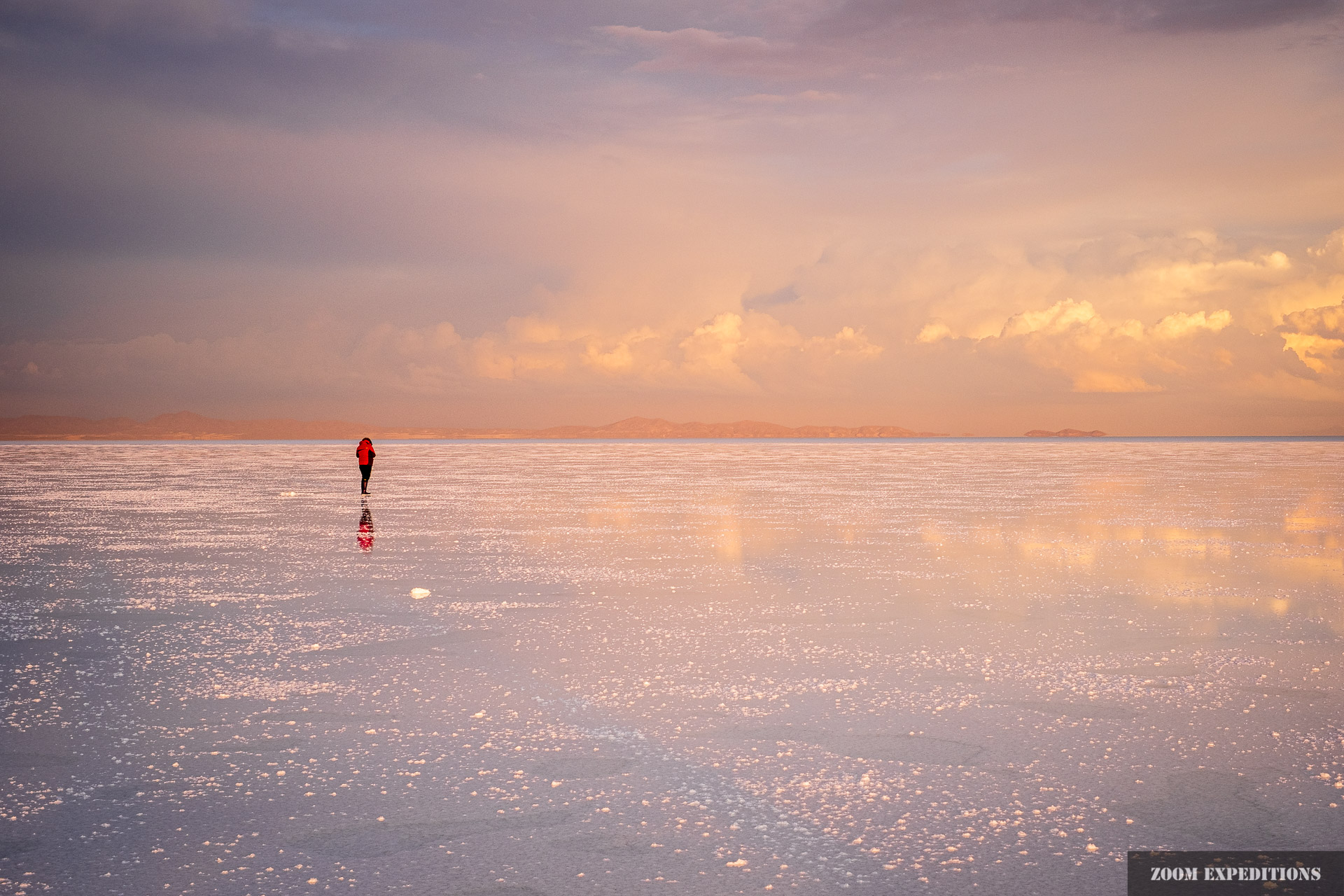 Salar de Uyuni photographer and reflections sunset