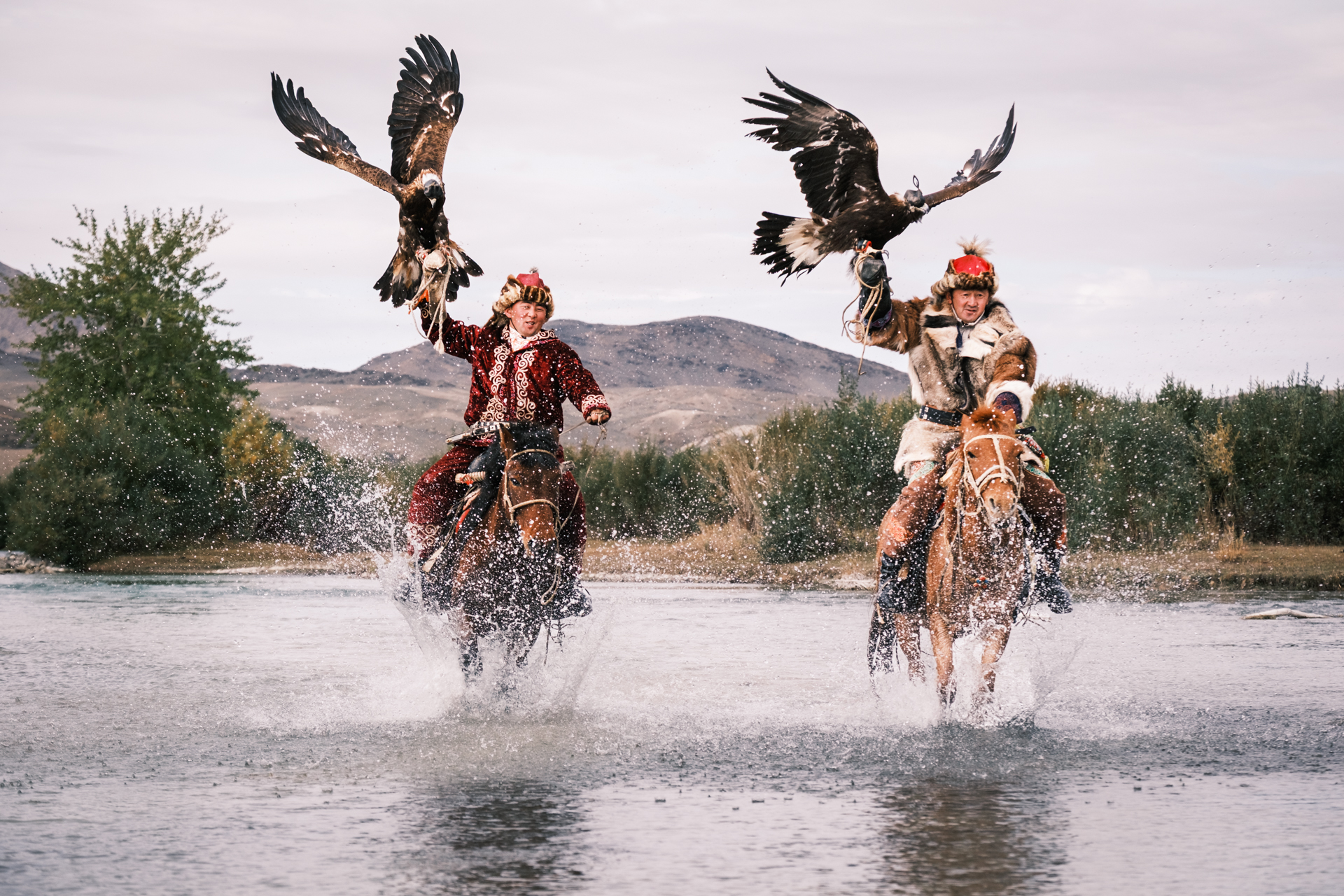 Eagle Hunters crossing a river.