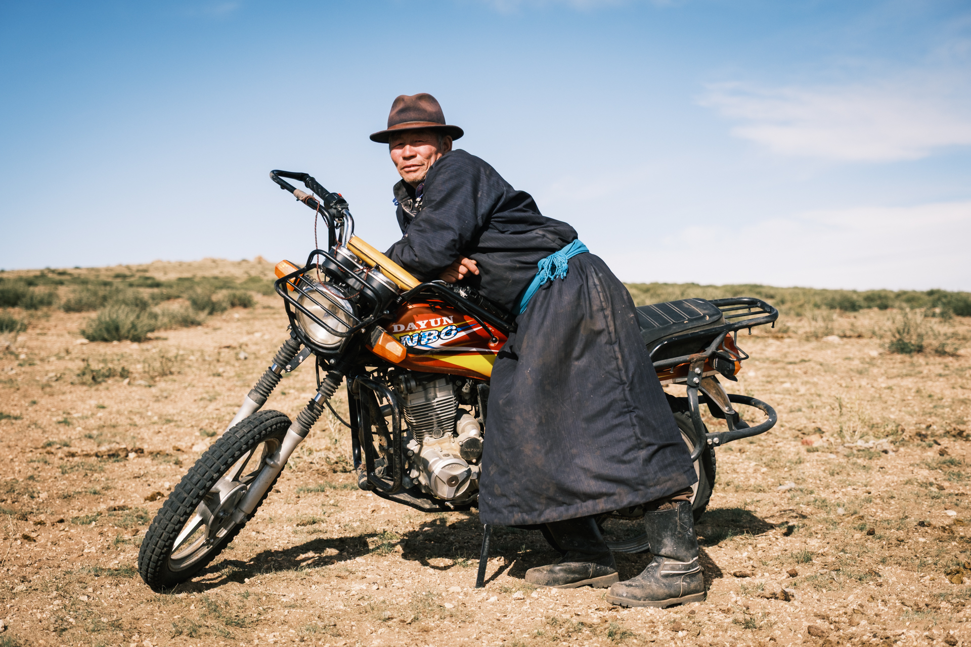 The nomads friend with his motorbike.
